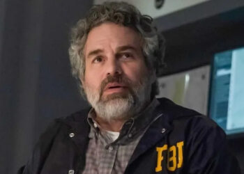 Tom Brandis wearing his FBI jacket in Task (2025)