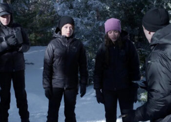 The cast of Agents of S.H.I.E.L.D. looking down while standing in the snow