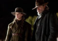 Hailee Steinfeld as Mattie Ross and Jeff Bridges as Rooster Cogburn in True Grit