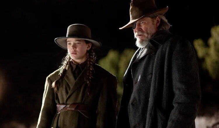 Hailee Steinfeld as Mattie Ross and Jeff Bridges as Rooster Cogburn in True Grit