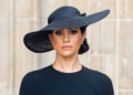 Meghan Markle wears a black dress and a black hat at Queen Elizabeth's funeral.