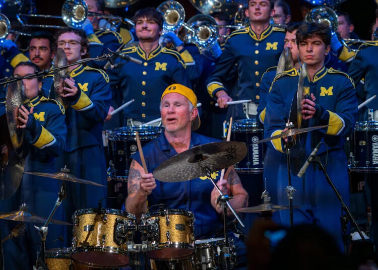 Chad Smith, center, performs with the University of Michigan Marching Band at Hill Auditorium in Ann Arbor, Michigan, on Nov. 2, 2025.