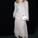elle fanning wears a sequined top and skirt