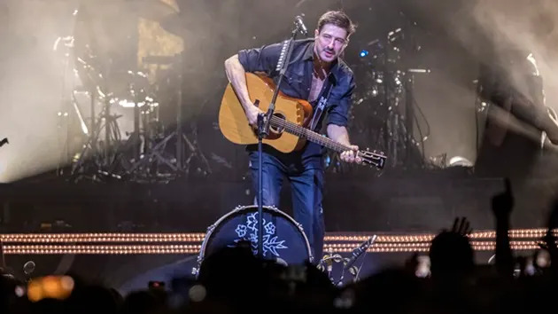 Marcus Mumford of Mumford & Sons performs onstage during a concert at Uber Arena on November 10, 2025 in Berlin, Germany. (Jakubaszek/Redferns)