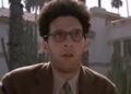 John Turturro wearing glasses outside in Barton Fink.