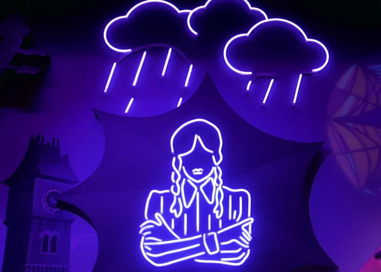 Neon lights of rain clouds and a girl.