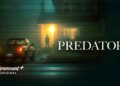 A car parked outside a house at night