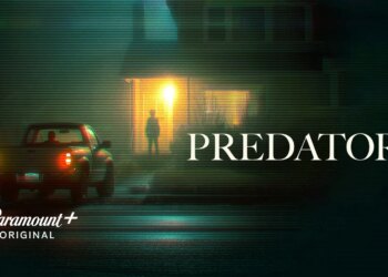 A car parked outside a house at night