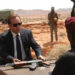 Nicolas Cage as Yuri Orlov in Lord of War, selling an AK-47 to a militant