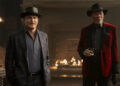 Woody Harrleson as Merritt McKinney standing by Morgan Freeman as Thaddeus Bradley as he drinks whiskey in Now You See Me: Now You Don't
