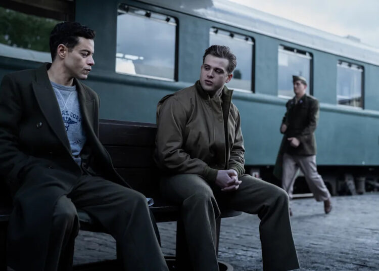 Douglas (Rami Malek, left) shares an emotional moment with translator Howie (Leo Woodall) in the historical drama "Nuremberg."
