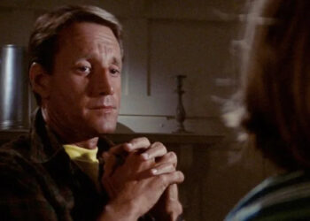Roy Scheider as Martin Brody shares a tender moment with his son at the dinner table in Jaws