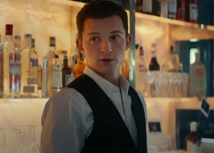 Tom Holland wearing tuxedo vest in Uncharted movie.