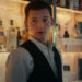 Tom Holland wearing tuxedo vest in Uncharted movie.
