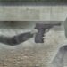Straftat protagonist character pointing gun at other Straftat main character