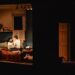 Cher Álvarez and Patrick Heusinger sit in bed in the play "Paranormal Activity."