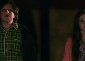 Isak Tufic and Teagan Sucherman as two siblings standing side by side in Pluribus