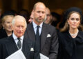 King Charles, Prince William and Kate Middleton looking somber as they wear matching black formal attire outside a church.