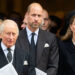 King Charles, Prince William and Kate Middleton looking somber as they wear matching black formal attire outside a church.