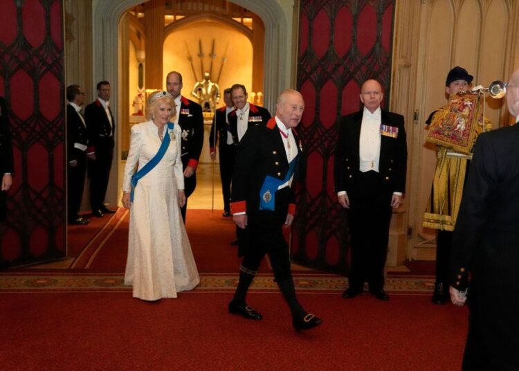 The Queen wore a white embellished gown