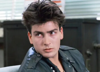 Charlie Sheen in Ferris Bueller's Day Off, wearing a leather jacket and with feathery hair