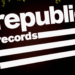 The image shows the Republic Records logo, featuring bold white text and stripes on a black background.