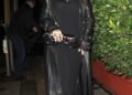 Rihanna wore an extra-long black leather trench coat with her Gucci horsebit bag