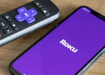 Roku app on a phone next to a controller