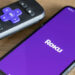 Roku app on a phone next to a controller