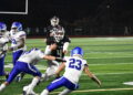 Lincoln Moore runs the ball for Kentlake. Ben Ray / The Reporter