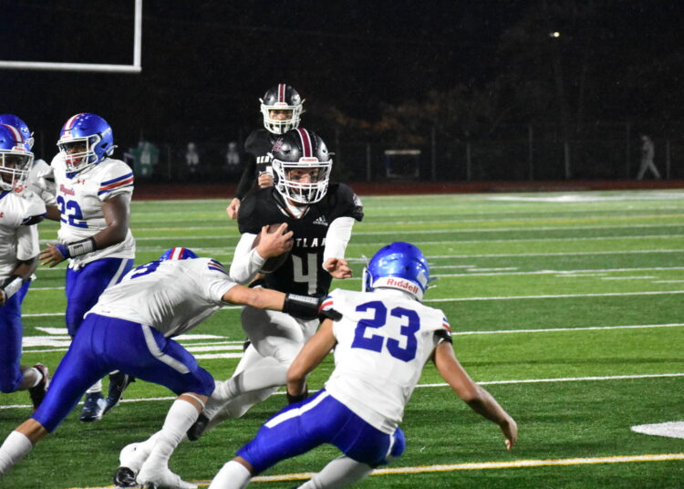 Lincoln Moore runs the ball for Kentlake. Ben Ray / The Reporter