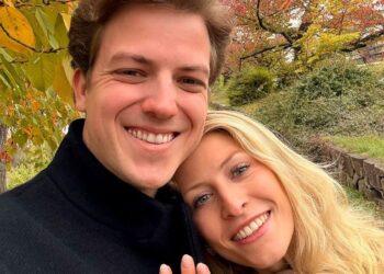 A photo of a blonde girl and brunette boy