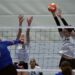 Peyton Mannin blocks a spike.