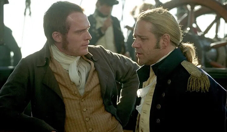 Paul Bettany as Stephen Maturin conults with Russell Crowe as Captain Jack Aubrey in Master and Commander: The Far Side of the World