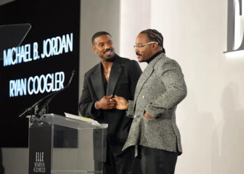 Michael B. Jordan and Ryan Coogler speak onstage during ELLE's 2025 Women in Hollywood Celebration on Nov. 17, 2025, in Los Angeles.