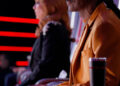 Snoop Dogg and Reba sitting in their red chairs on The Voice