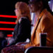 Snoop Dogg and Reba sitting in their red chairs on The Voice