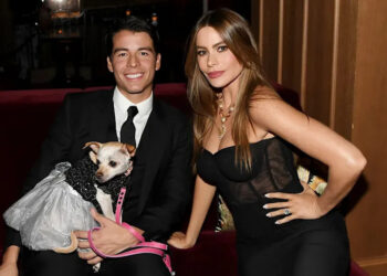 Sofia Vergara in a black dress with her son Manolo Gonzalez Vergara and their dog