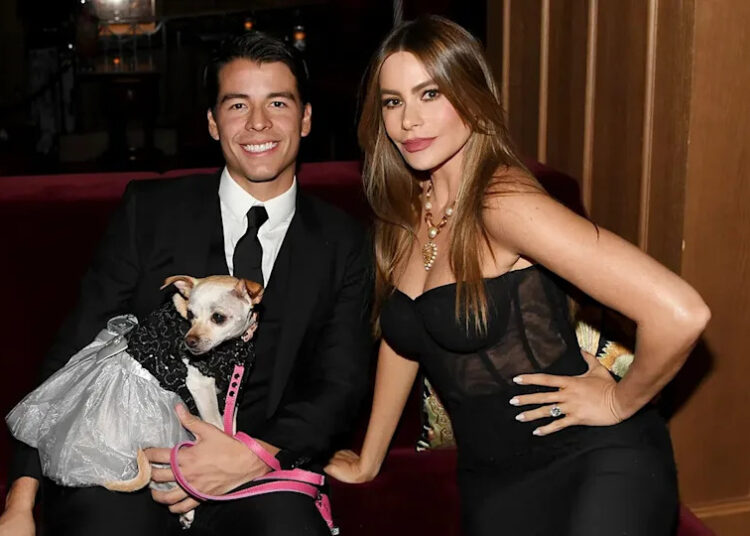 Sofia Vergara in a black dress with her son Manolo Gonzalez Vergara and their dog