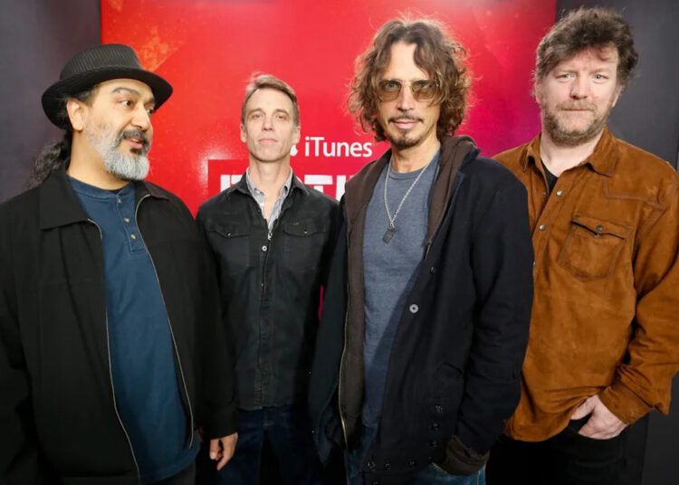 Soundgarden members Kim Thayil, Matt Cameron, Chris Cornell and Ben Shepherd standing in a line.