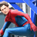 Tom Holland's unmasked superhero posing and looking over his left shoulder in Spider-Man: Brand New Day.