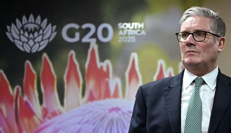 Sir Keir Starmer spoke to reporters on his way to the G20 in South Africa. Pic: Reuters