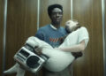 Stranger Things, Lucas holding Max in an elevator