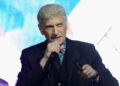 Dennis DeYong performing on stage