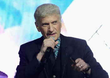 Dennis DeYong performing on stage