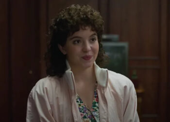 Sydney Sweeney with brunette perm as Christy .