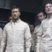 Glen Powell and others in white paint suits