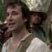 Noah Wyle as Flynn Carsen stands beside Sonya Walger as Nicole Noone while surrounded by guns in The Librarian: Quest for the Spear