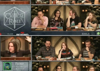 Cast of Critical Role playing Dungeons & Dragons around a table during a game session, showing animated expressions and interactions