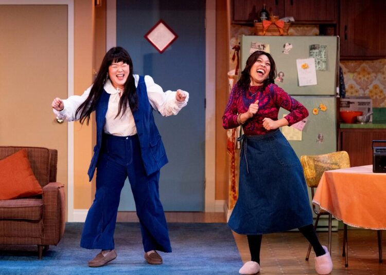 Narea Kang, left, and Nicole Javier in South Coast Repertory's 2025 production of "The Heart Sellers" by Lloyd Suh.